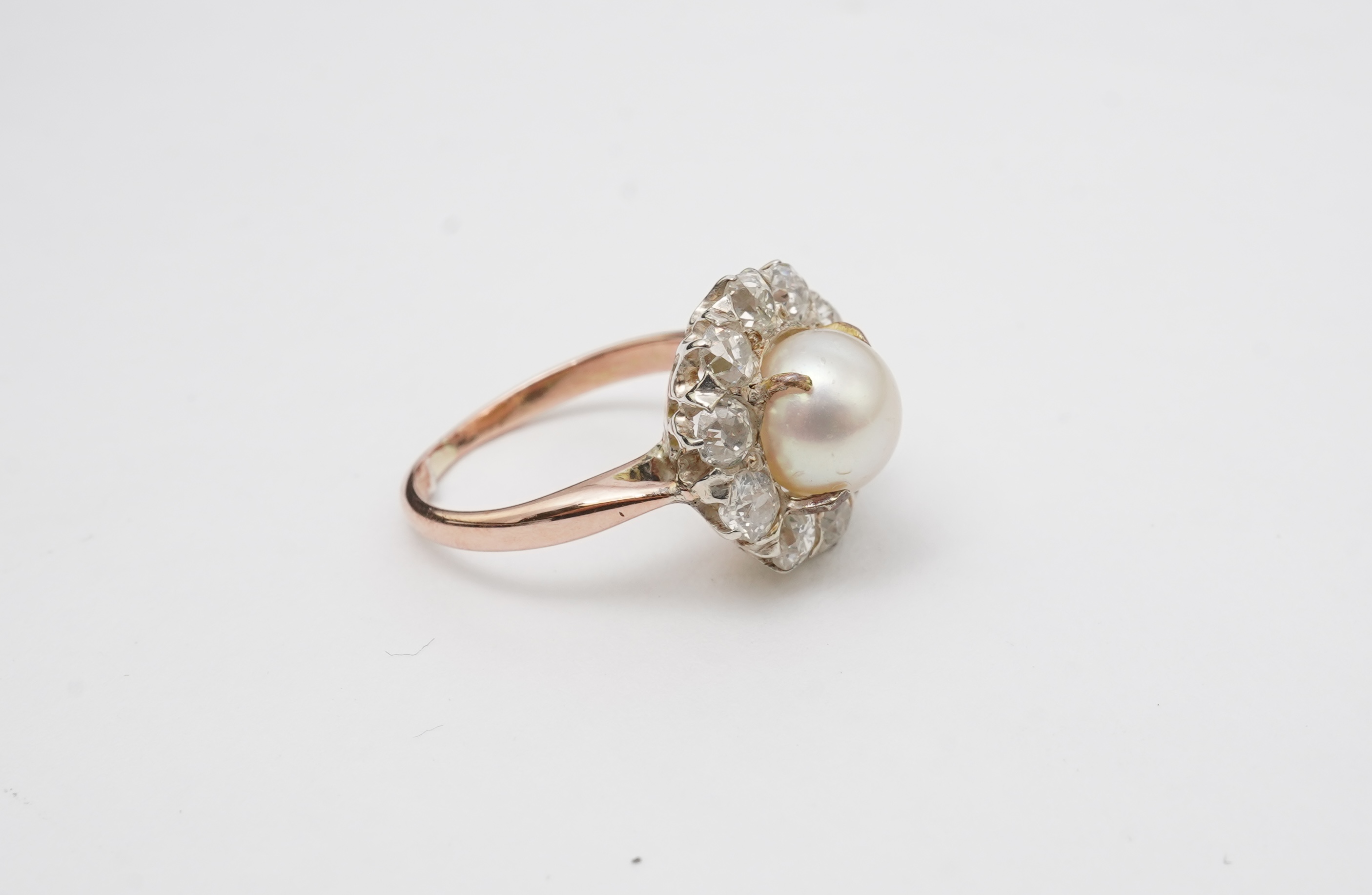 A cultured pearl and diamond ring
